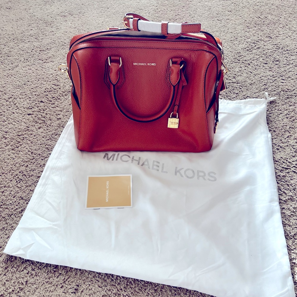 Beautiful Michael Kors bag. Like new, some wrapping still attached.